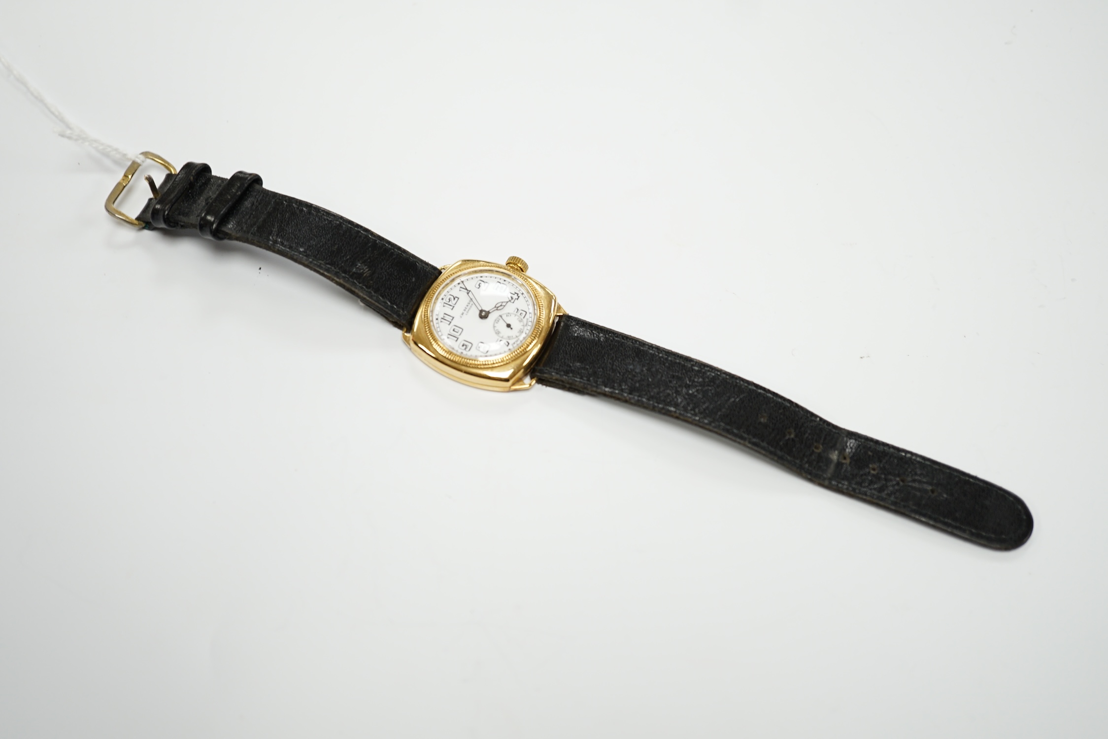 A gentleman's yellow metal J.W. Benson manual wrist watch, with Arabic dial and subsidiary seconds, on a black leather strap.